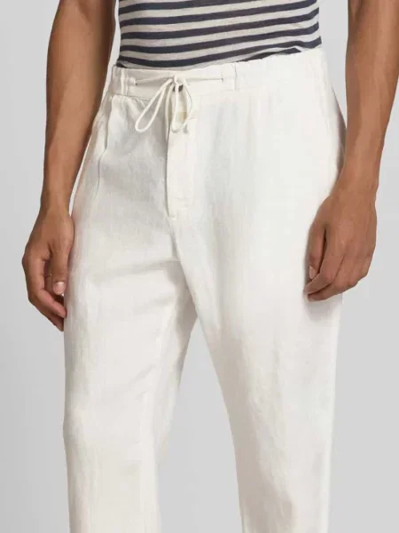 Spodnie z lnu krój tapered fit Closed białe