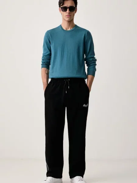 Guess Jeans teplákové nohavice pánske s bavlnou čierna