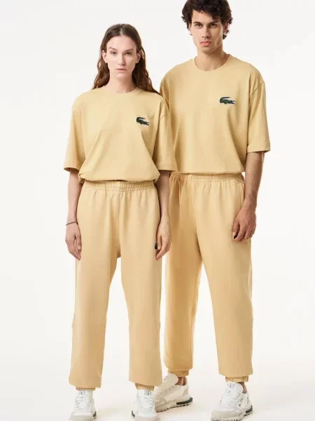 Дитячі спортивні штани Lacoste бежеві