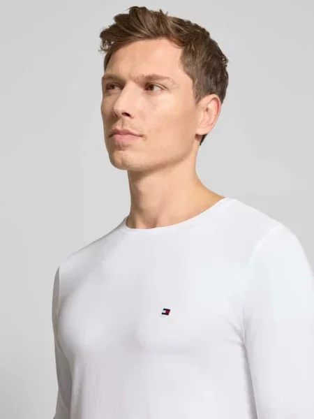 Bluzka z długim rękawem o kroju slim fit z mieszanki bawełny Tommy Hilfiger biała