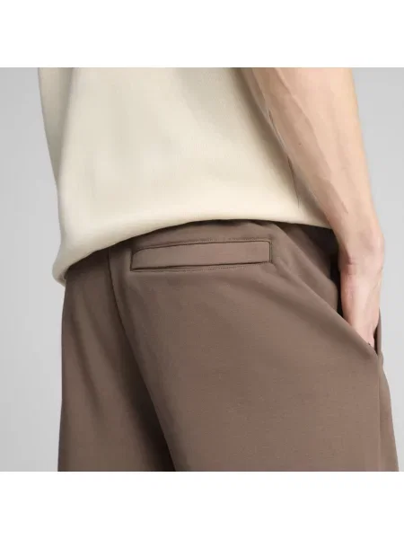 PUMA spodnie dresowe o luźnym kroju WARDROBE ESS Odzież L brązowy
