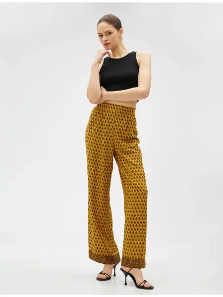 Spodnie Koton z etnicznym nadrukiem pomarańczowe