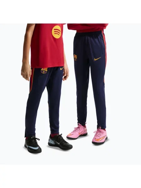 Pantaloni de fotbal pentru copii Nike FC Barcelona Strike Dri-Fit blackened blue/noble red/yellow roșu