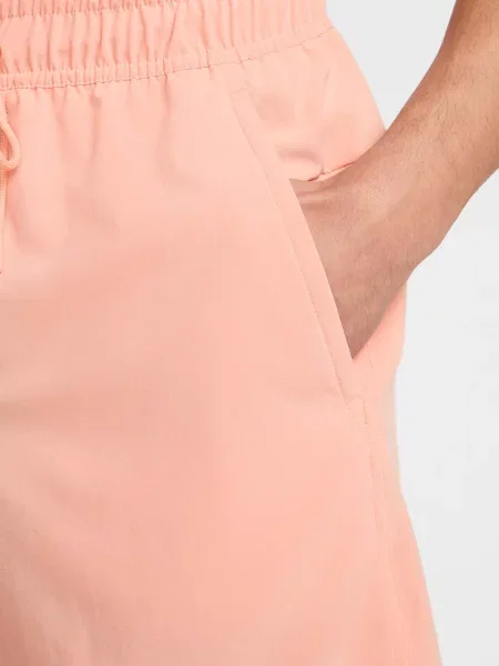 Спортивні шорти NIKE DRI-FIT UNLINED VERSATILE персик поліестер/спандекс