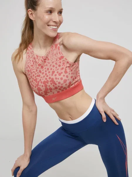 Sportovní podprsenka Reebok oranžová vzorovaný