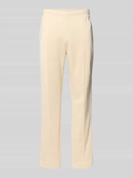 Spodnie dresowe w kroju regular fit z dodatkiem bawełny Lacoste beżowe