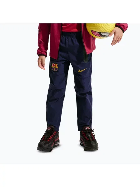 Pantaloni de fotbal pentru copii Nike FC Barcelona Tech Woven blackened blue/black/mineral yellow negru