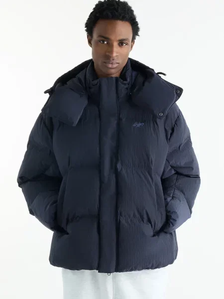 Пуховик New Balance синій