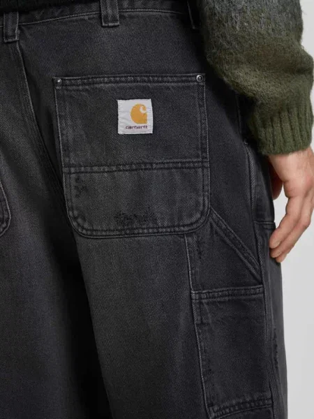 Dżinsy krój wide fit naszywka z logo model Grind' Carhartt Work In Progress czarne