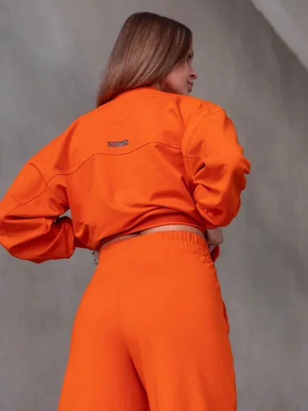 Женский костюм с брюками палаццо помаранчеві