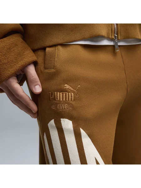 PUMA spodnie dresowe KING o kroju oversize Odzież S brązowy
