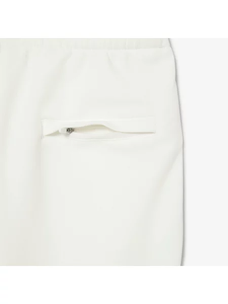 Зауженные спортивные штаны Lacoste белые