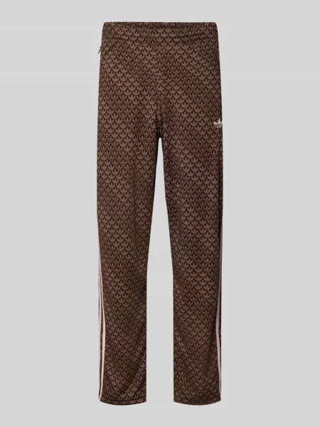 Spodnie dresowe o kroju loose fit z wzorem z logo model FIREBIRD' Adidas Originals