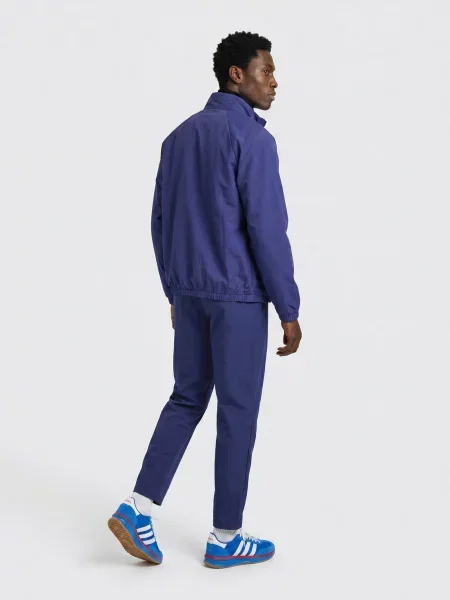 Vjetrovka Adidas s autogramom plava