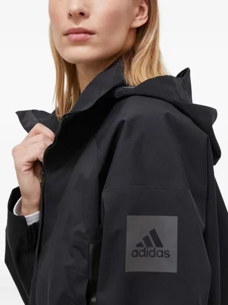 Geacă cu puf Adidas din piele de căprioară cu dungi cu glugă albastru