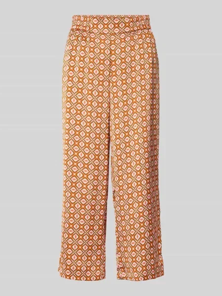 Spodnie materiałowe o rozkloszowanym kroju w stylu retro Christian Berg Woman Selection pomarańczowe