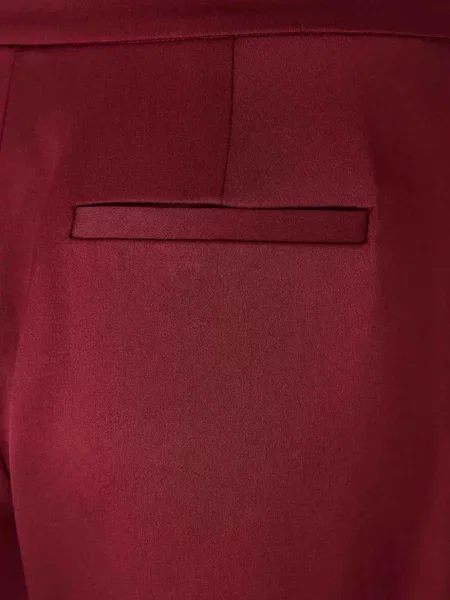 Pantaloni Simkhai de lână plisate roșu