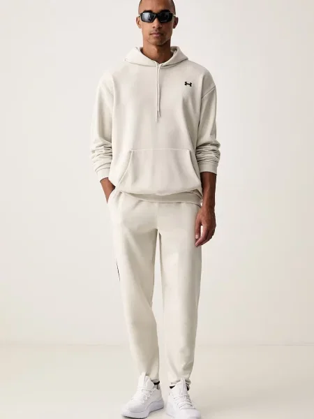 Under Armour pulover s kapuco z bombažem Icon bež