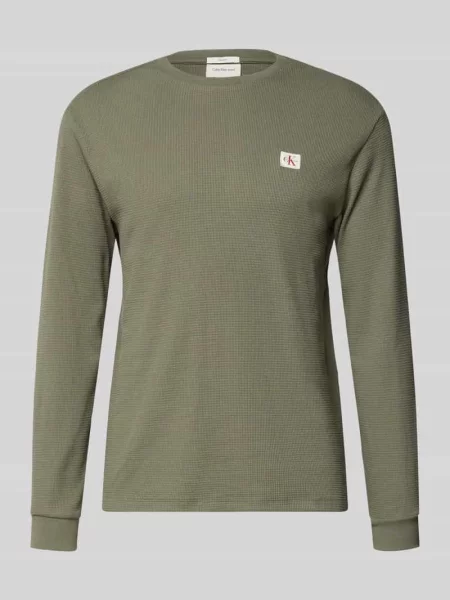 Bluzka z długim rękawem o kroju regular fit z mieszanki bawełny Calvin Klein Jeans fioletowa