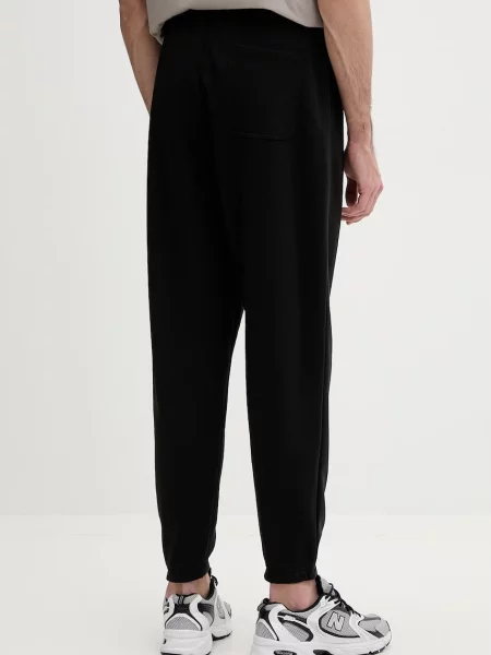 Spodnie dresowe o kroju regular fit z mieszanki bawełny Tommy Jeans czarny