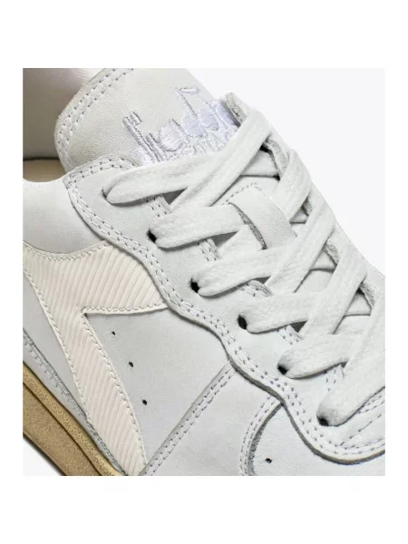 Sneakersy Diadora skórzane z przetarciami białe