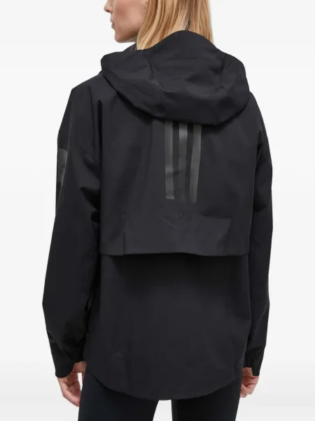Geacă cu puf Adidas din piele de căprioară cu dungi cu glugă albastru