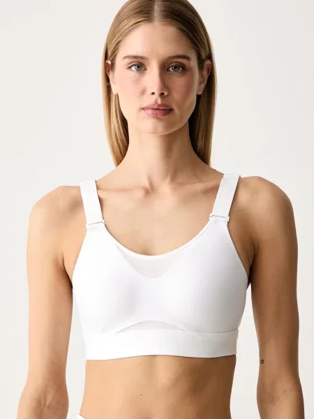 Under Armour sportovní podprsenka Infinity bílá