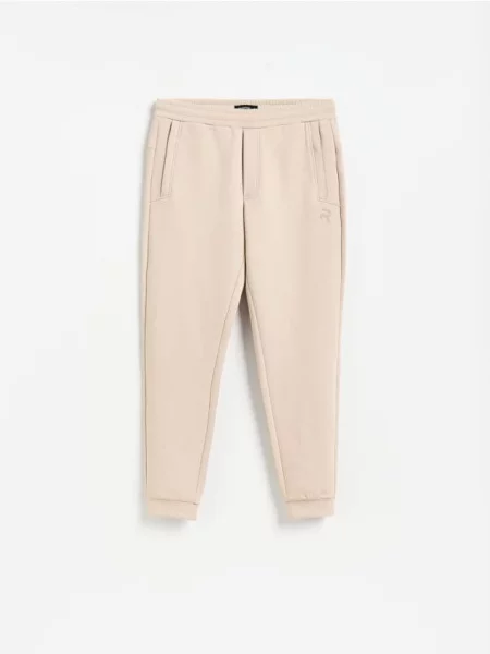Reserved Spodnie dresowe slim fit beżowy