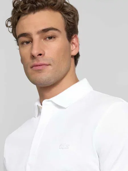 Koszulka polo o kroju regular fit z mieszanki bawełny Lacoste biała