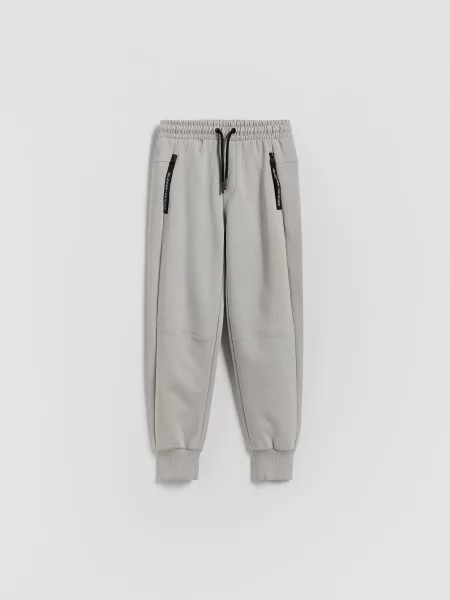 Reserved Sportovní jogger kalhoty světle šedá