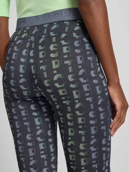 Spodnie o kroju slim fit z detalem z logo Marc Cain niebieskie