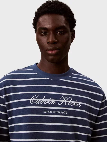 У смужку повсякденна футболка Calvin Klein Jeans синя