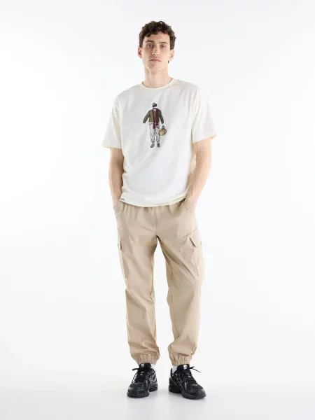 Футболка New Balance бежевий