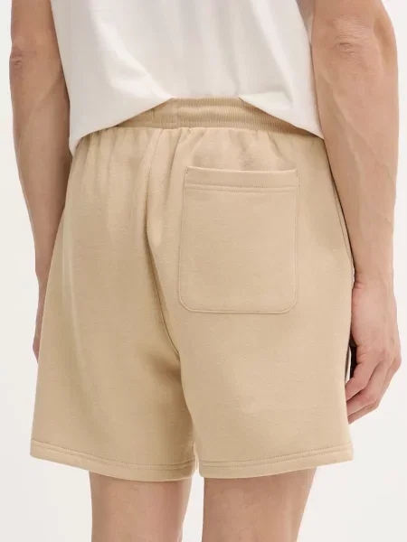 Szorty chinosy o kroju regular fit z mieszanki bawełny Tommy Jeans beżowe