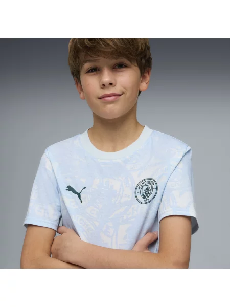 PUMA Młodzieżowa koszulka Manchester City FtblCulture z nadrukiem na całej powierzchni Odzież niebieski