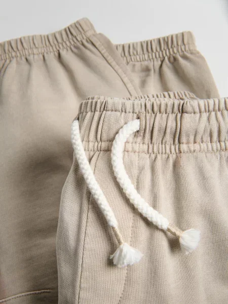 Reserved Спортивні штани з ефектом прання бежевий