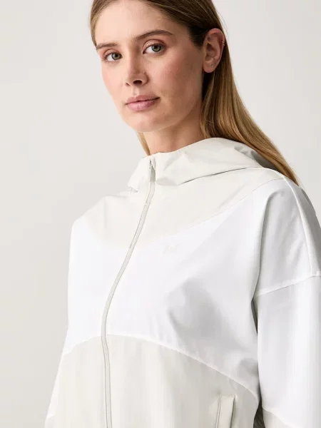 Under Armour átmeneti kabát női Rival Woven bézs