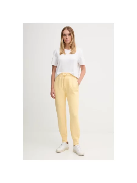 Lacoste spodnie dresowe żółte