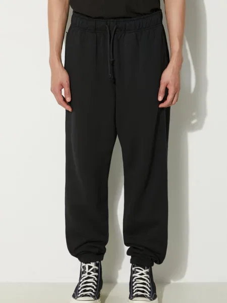 Donji dio trenirke New Balance bez uzorka crna