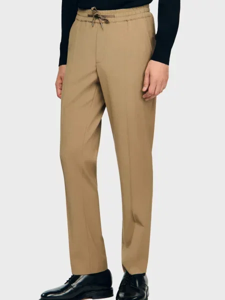 Шерстяные брюки Sandro бежевые