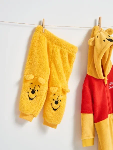 Sinsay Kalhoty Winnie the Pooh hořčicová