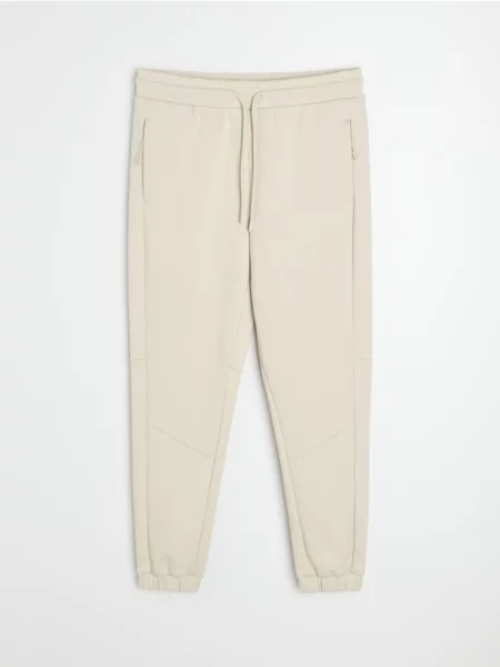 Sinsay Kalhoty tapered fit Active béžová