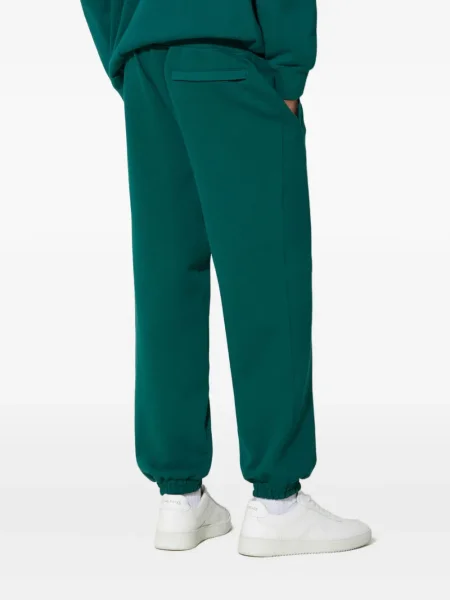 Pantaloni Puma cu broderie verde
