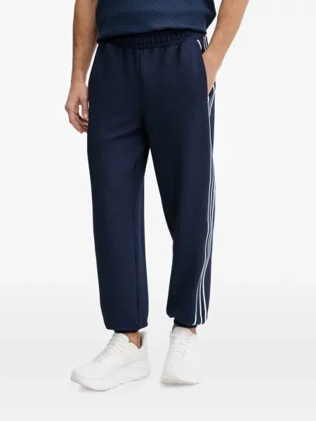 Pantaloni Guess cu dungi alergare albastru