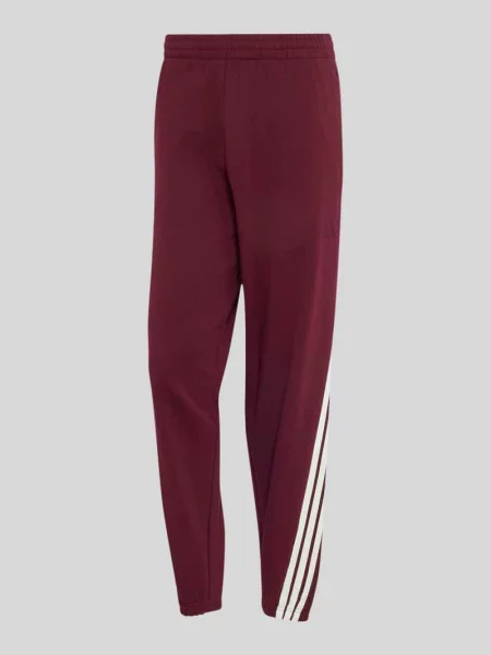 Spodnie dresowe o kroju regular fit z zapinanymi na błyskawiczny Adidas Sportswear