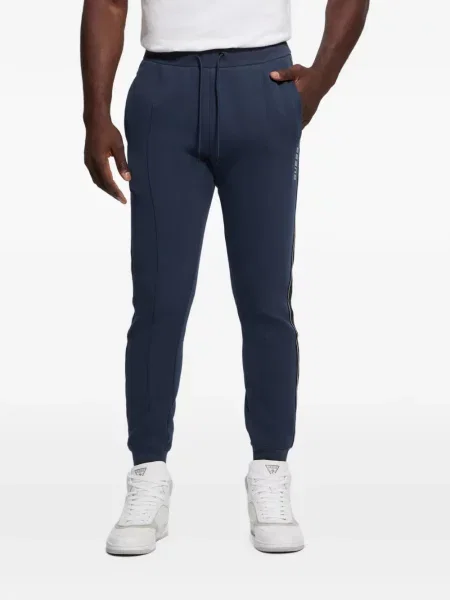 Pantaloni Guess cu dungi alergare albastru