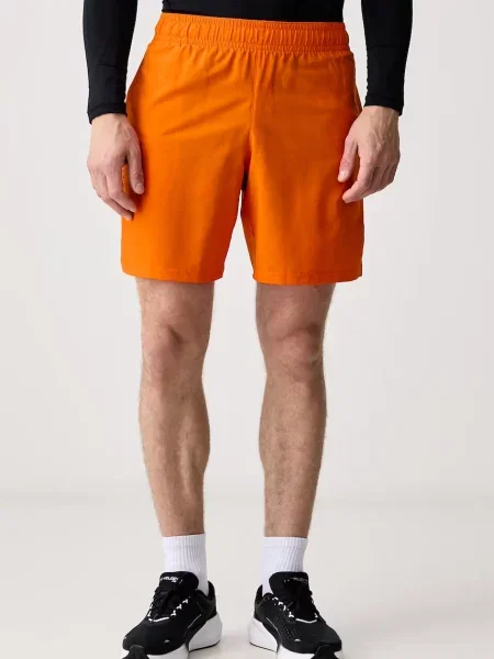 Under Armour sportovní šortky Vanish Woven oranžové