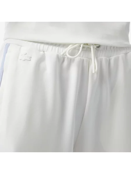 Расклешенные спортивные штаны Lacoste белые