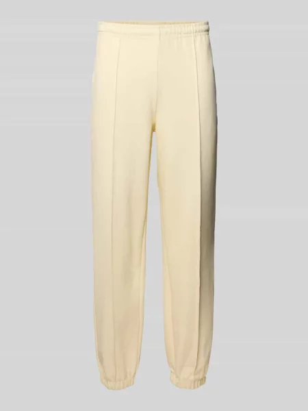 Spodnie dresowe o kroju regular fit z mieszanki bawełny Lacoste beżowe