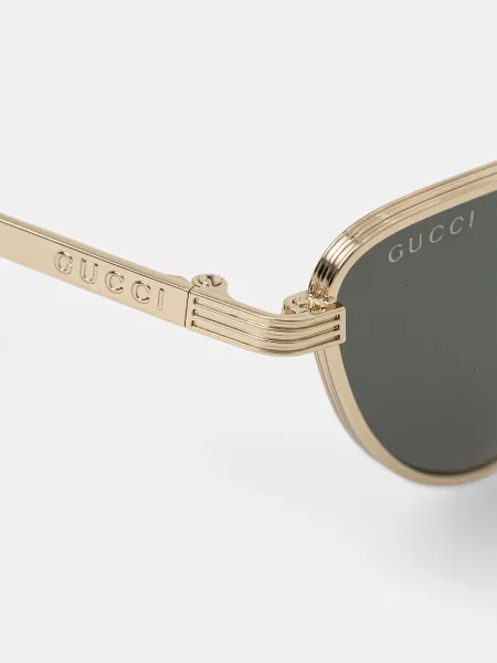 Солнцезащитные очки Gucci золотые